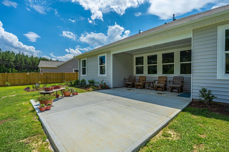 Exterior details and patio area of a home in French Quarter Creek, Huger (Image 23).