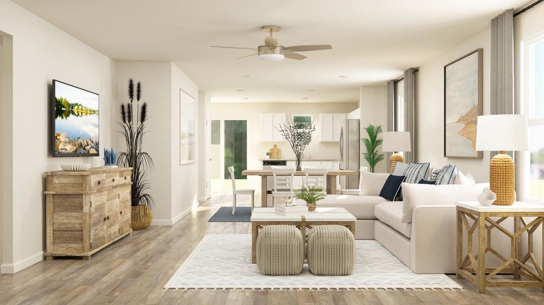 A living room with a white couch and a table. A living room with a white couch and a table.