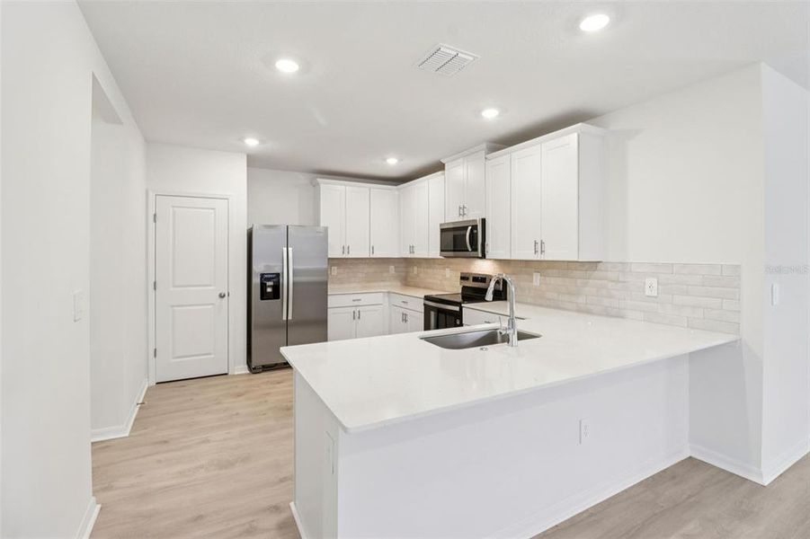 Furnished interior view inside a new home in Ridgehaven - Villas, Ormond Beach (Image 8).
