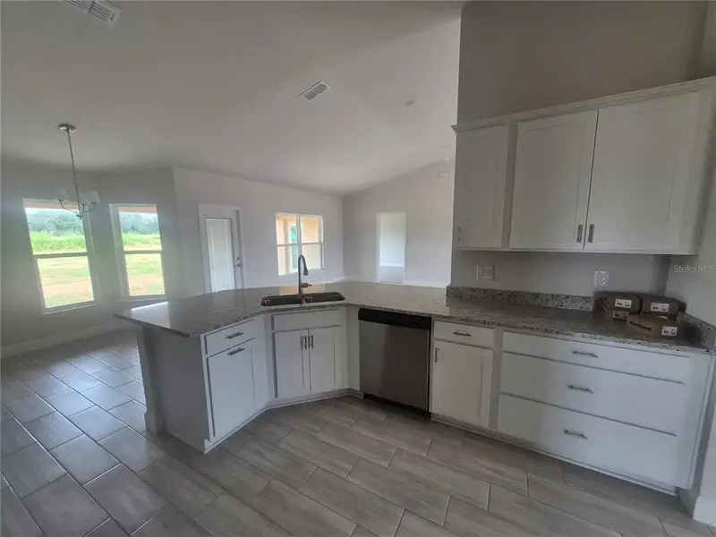 Furnished interior in a model home at Hill Country Estates in Dade City (Image 3).