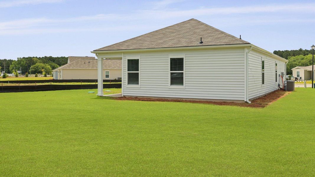 Front exterior of a new home in Evergreen, Holly Hill, SC, highlighting curb appeal (Image 19).