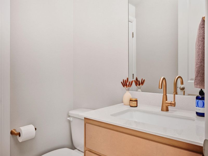 A powder room on the main level is perfect for entertaining, keeping all full baths private.