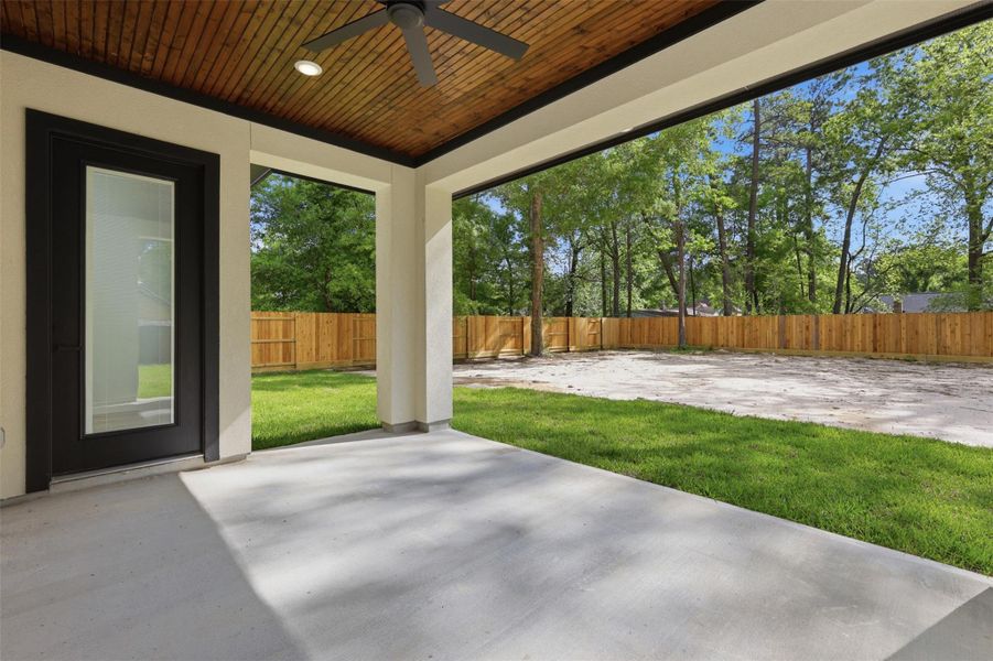 Wood-lined ceilings on the back porch, to enjoy the backyard views!