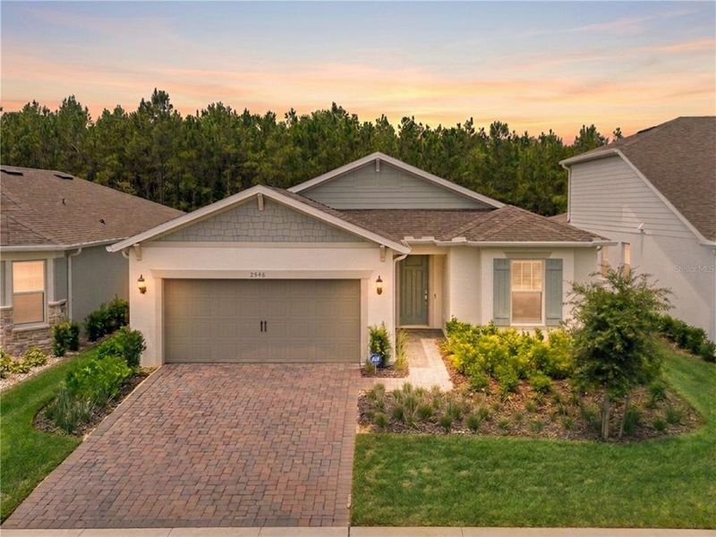 Front exterior of a new home in , Minneola, FL, highlighting curb appeal (Image 26). Front exterior of a new home in , Minneola, FL, highlighting curb appeal (Image 26).