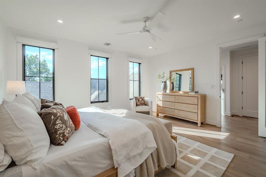 Bedroom with recessed lighting, wood finished floors, and ceiling fan Bedroom with recessed lighting, wood finished floors, and ceiling fan
