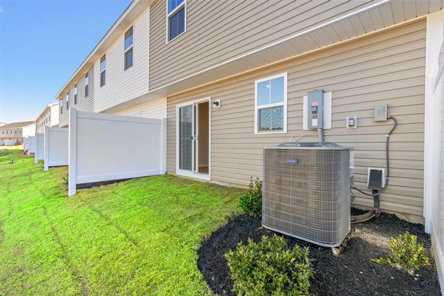 Exterior details and patio area of a home in Meadows Edge, Conway (Image 3).