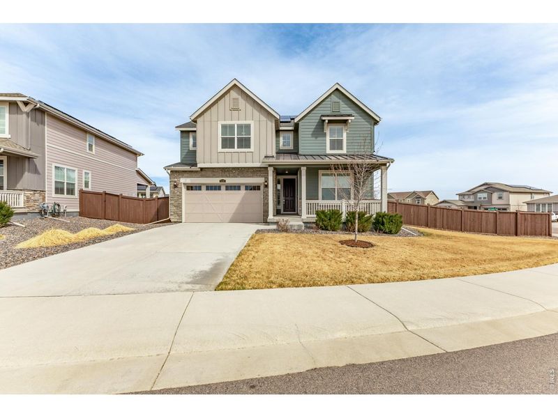 Front exterior of a new home in , Thornton, CO, highlighting curb appeal (Image 1). Front exterior of a new home in , Thornton, CO, highlighting curb appeal (Image 1).