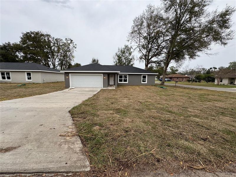 Front exterior of a new home in , Summerfield, FL, highlighting curb appeal (Image 1). Front exterior of a new home in , Summerfield, FL, highlighting curb appeal (Image 1).