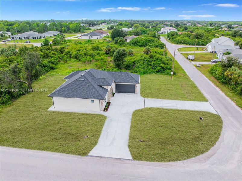Front exterior of a new home in , Lehigh Acres, FL, highlighting curb appeal (Image 25). Front exterior of a new home in , Lehigh Acres, FL, highlighting curb appeal (Image 25).