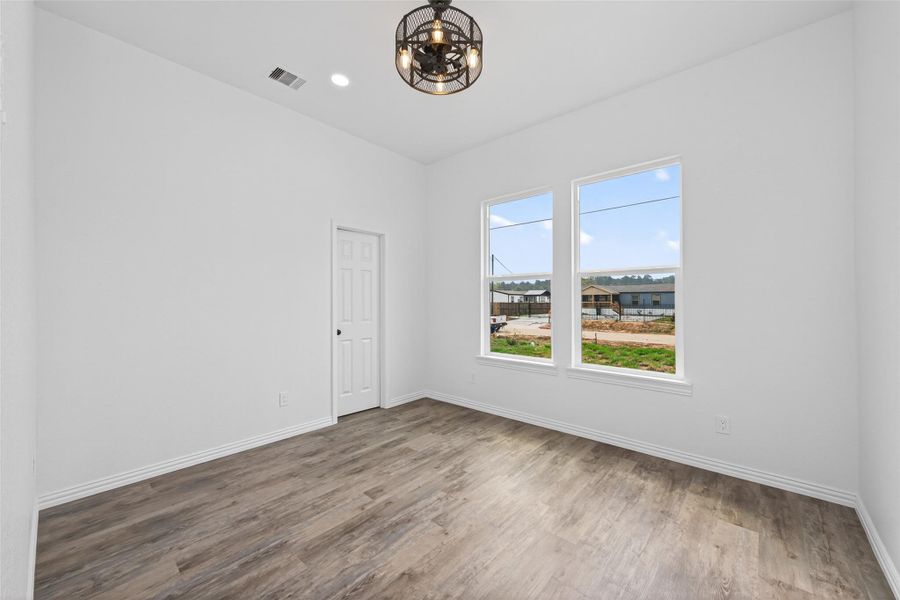 Spacious bedroom with easy access to the shared bathroom.