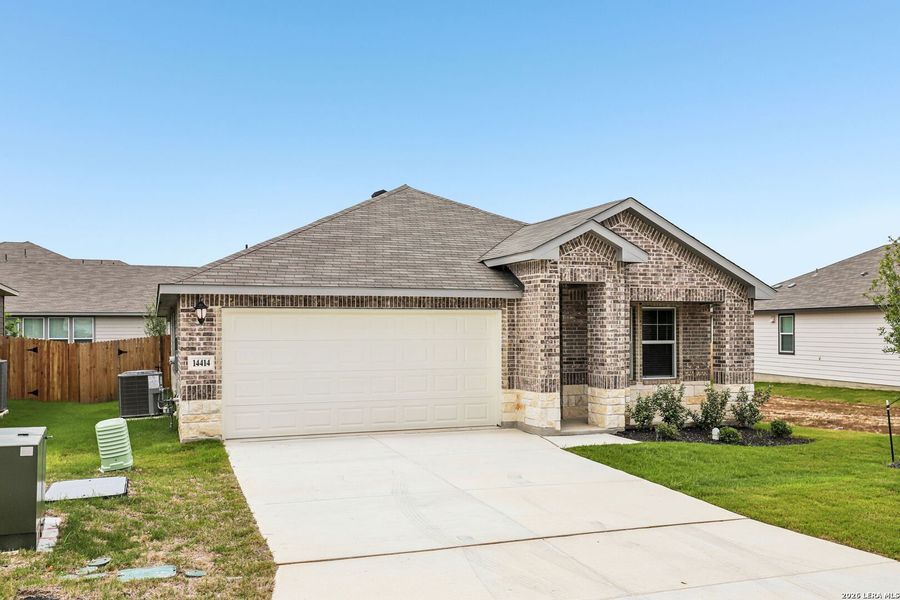 Front exterior of a new home in Thomas Pond, San Antonio, TX, highlighting curb appeal (Image 22). Front exterior of a new home in Thomas Pond, San Antonio, TX, highlighting curb appeal (Image 22).