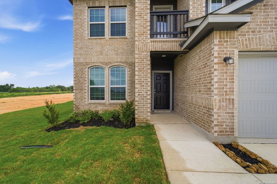 Exterior details and patio area of a home in Hickory Ridge, Elmendorf (Image 3).
