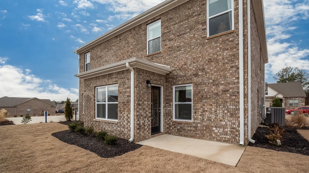 Front exterior of a new home in Shiloh Springs, Jackson, TN, highlighting curb appeal (Image 1).