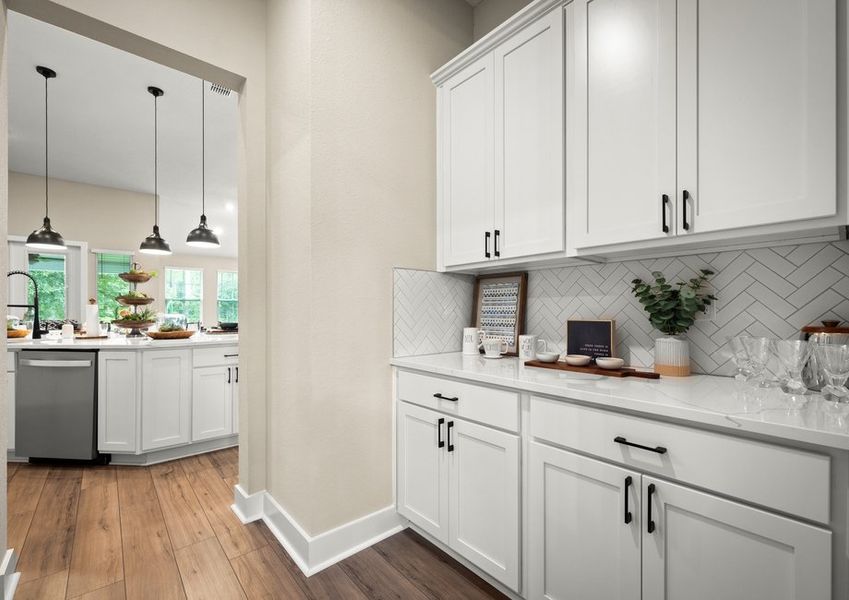 Butler's pantry with white cabinets.