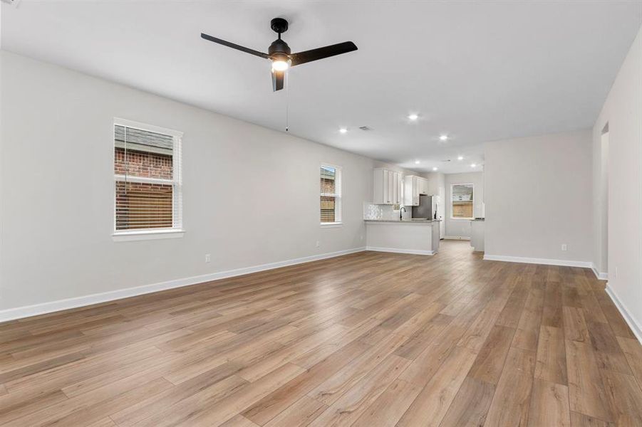 The expansive living room leads right into the kitchen, making this the perfect space to gather with family and friends.