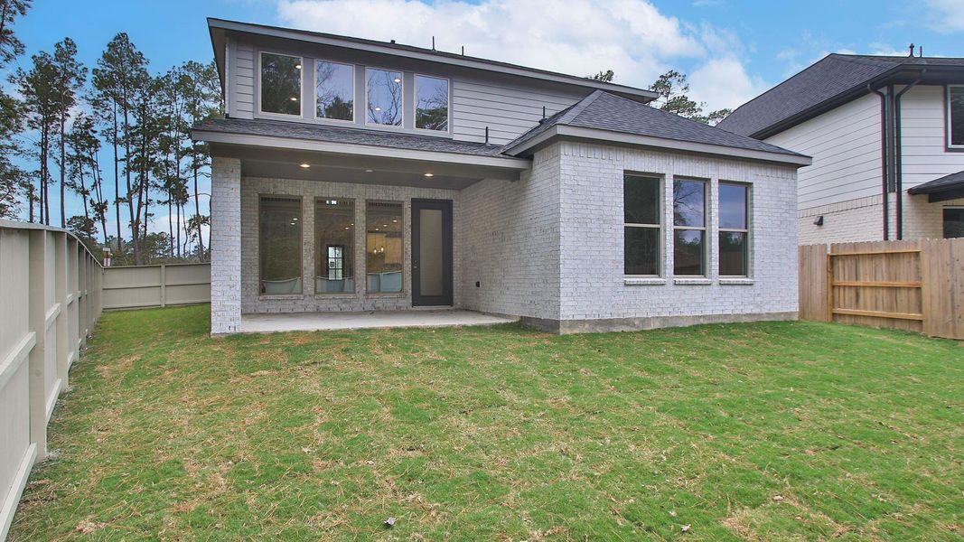 Exterior details and patio area of a home in Audubon Park 45', Magnolia (Image 3).