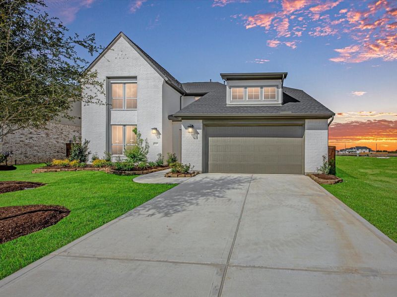 Front exterior of a new home in Dunham Pointe 60′, Cypress, TX, highlighting curb appeal (Image 2).