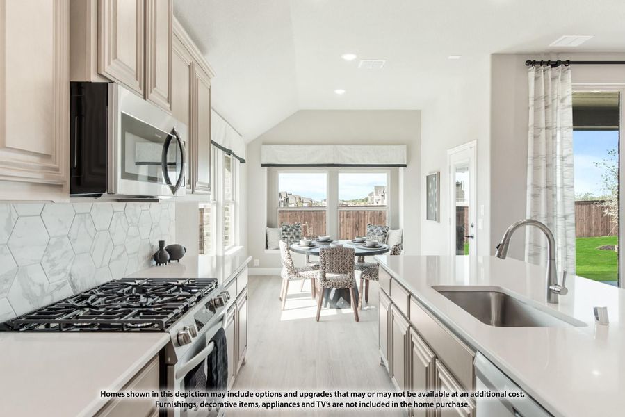 Kitchen with gray cabinets, gas range, hexagon tile backsplash, and breakfast nook with vaulted ceiling Kitchen with gray cabinets, gas range, hexagon tile backsplash, and breakfast nook with vaulted ceiling