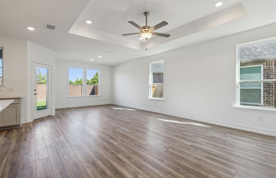 Airy gathering room with Tray ceiling*real home pictured