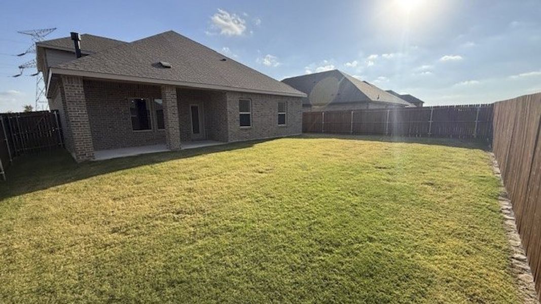 Exterior details and patio area of a home in Fireside by the Lake, Garland (Image 3).