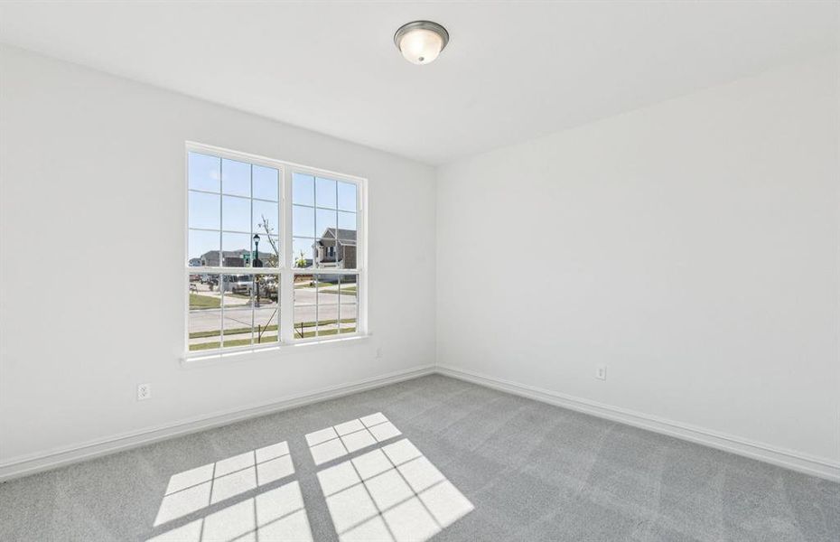 Comfortable bedroom with a bright window view Comfortable bedroom with a bright window view