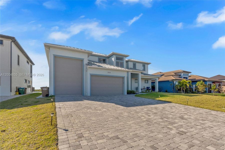 Front exterior of a new home in , Cape Coral, FL, highlighting curb appeal (Image 23).