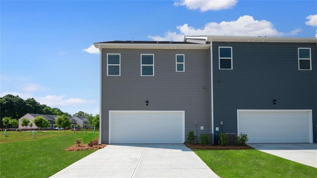 Front exterior of a new home in Brookland Commons, Monroe, GA, highlighting curb appeal (Image 1). Front exterior of a new home in Brookland Commons, Monroe, GA, highlighting curb appeal (Image 1).