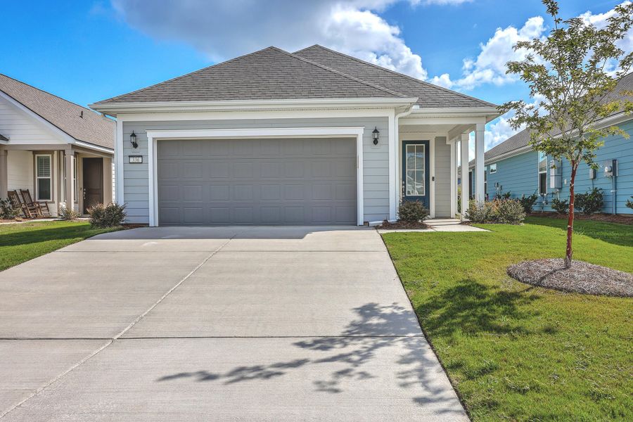 Front exterior of a new home in Del Webb Charleston at Nexton, Summerville, SC, highlighting curb appeal (Image 25). Front exterior of a new home in Del Webb Charleston at Nexton, Summerville, SC, highlighting curb appeal (Image 25).