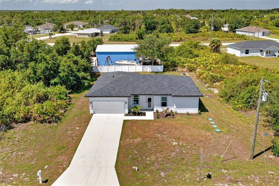 Front exterior of a new home in , Port Charlotte, FL, highlighting curb appeal (Image 1). Front exterior of a new home in , Port Charlotte, FL, highlighting curb appeal (Image 1).