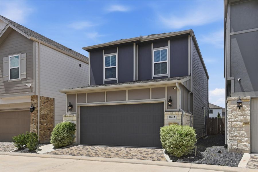 Front exterior of a new home in Dunvale Village - Townhome Collection, Houston, TX, highlighting curb appeal (Image 22).
