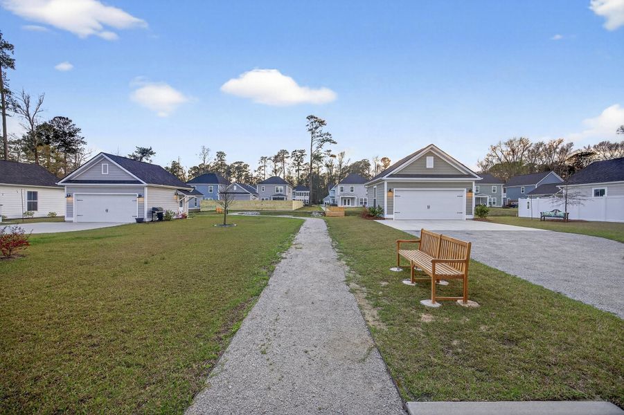 Front exterior of a new home in Pineland Village, Summerville, SC, highlighting curb appeal (Image 28).
