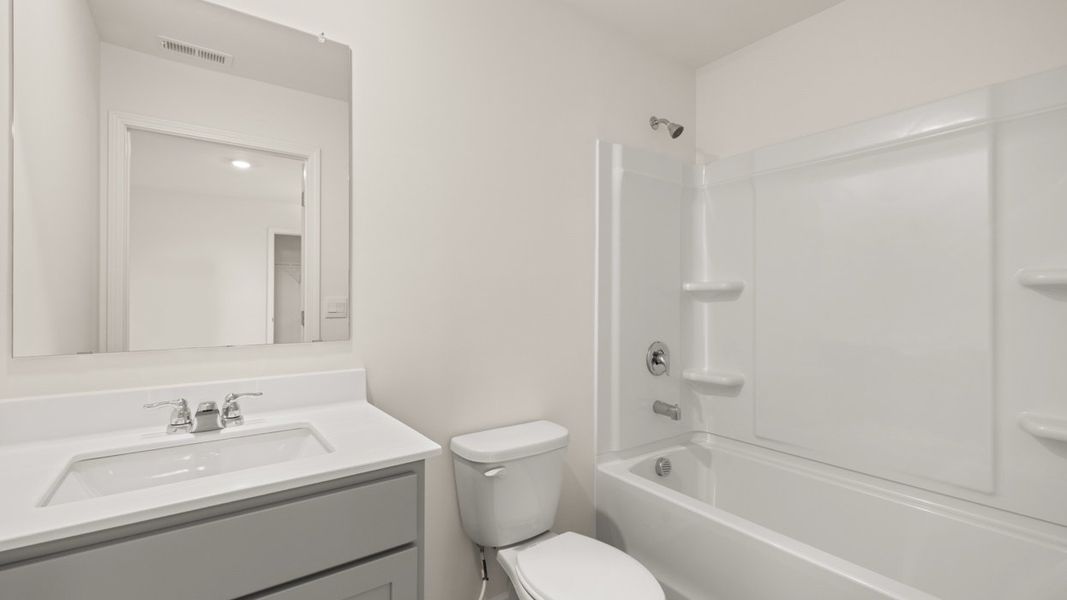 Representative furnished interior of a home built from the Hanover by D.R. Horton in The Reserve at Calcutta, Stockbridge (Image 9).