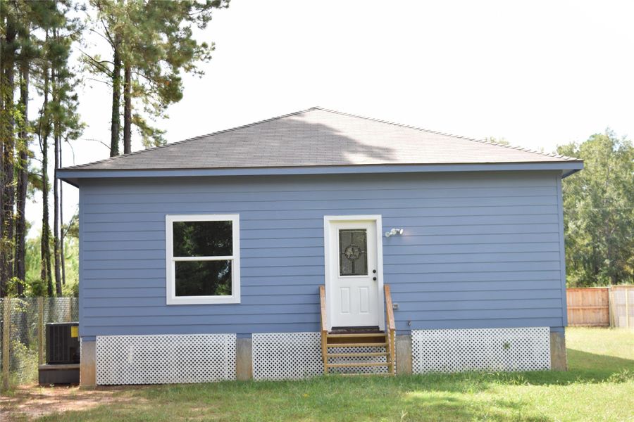 Front exterior of a new home in , Cleveland, TX, highlighting curb appeal (Image 2).