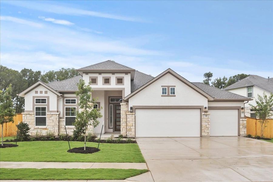Front exterior of a new home in 6 Creeks, Kyle, TX, highlighting curb appeal (Image 23). Front exterior of a new home in 6 Creeks, Kyle, TX, highlighting curb appeal (Image 23).