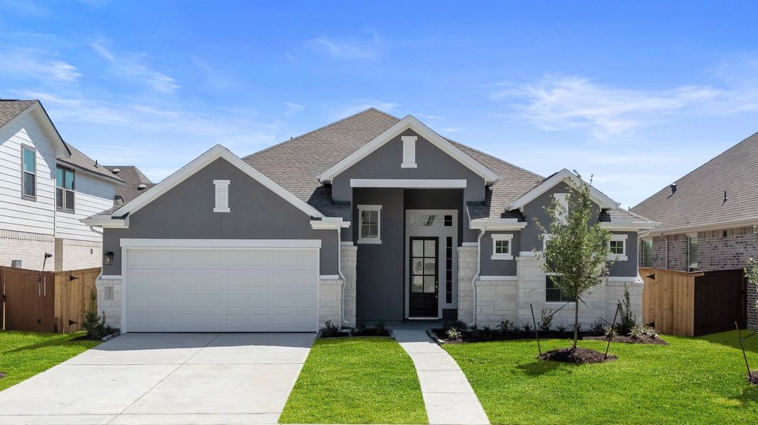 Front exterior of a new home in Jordan Ranch, Fulshear, TX, highlighting curb appeal (Image 18). Front exterior of a new home in Jordan Ranch, Fulshear, TX, highlighting curb appeal (Image 18).