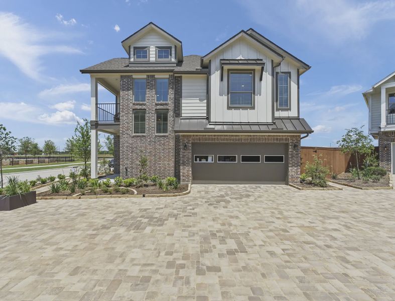Representative exterior photo of a completed home built from the Riverdale by Chesmar Homes in Sienna Courtyard, Missouri City, TX (Image 8).