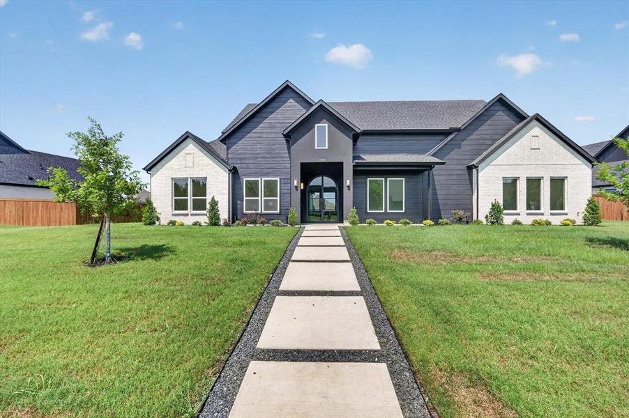 Front exterior of a new home in , Forney, TX, highlighting curb appeal (Image 1). Front exterior of a new home in , Forney, TX, highlighting curb appeal (Image 1).