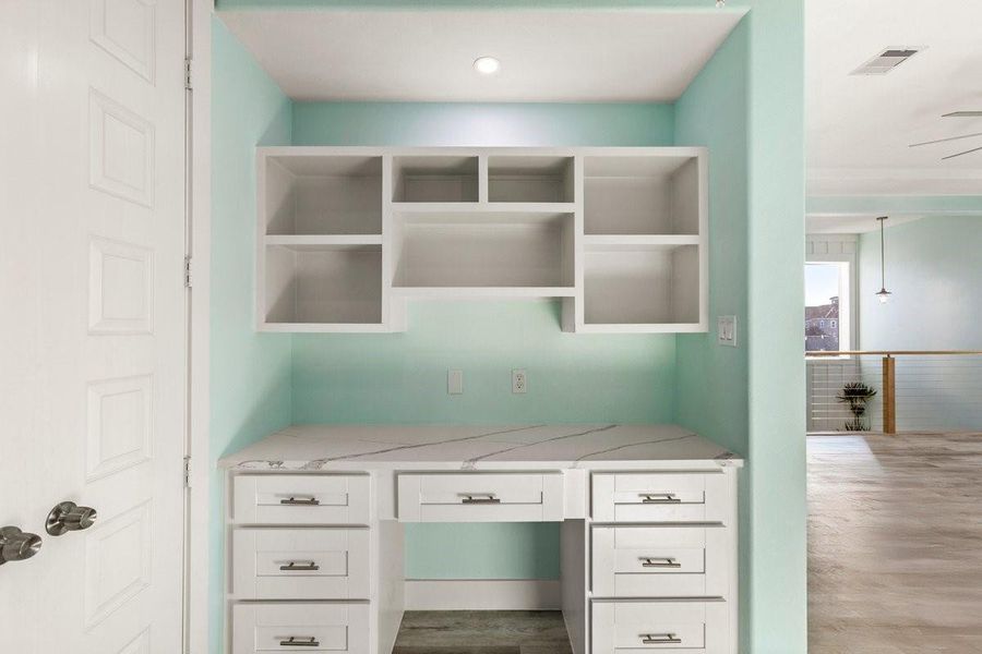 There are several custom-built desk areas.