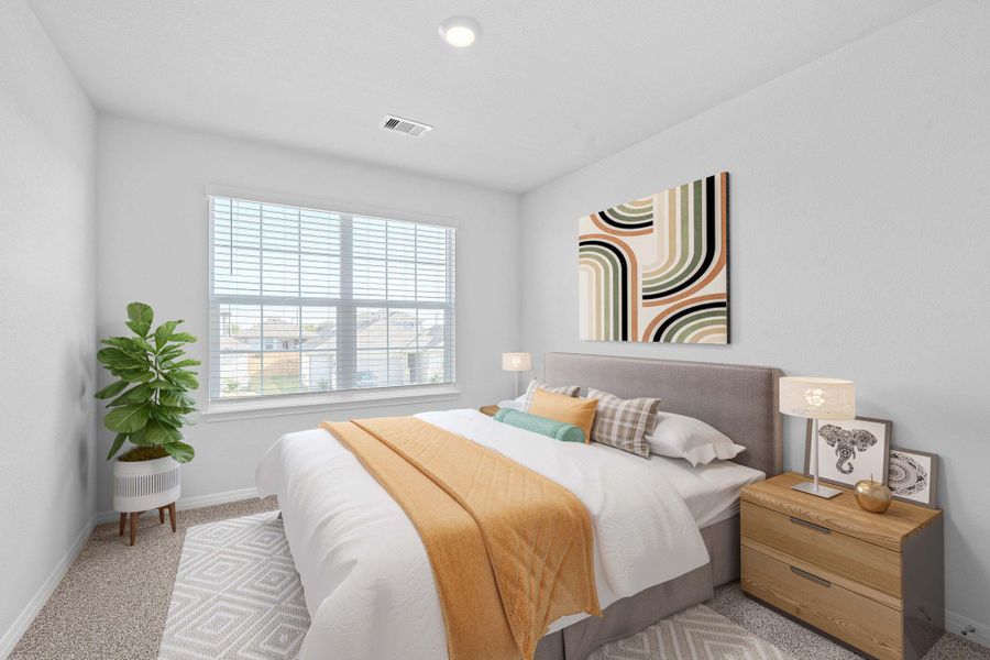 Carpeted bedroom with baseboards Carpeted bedroom with baseboards