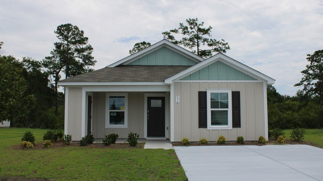 Representative exterior photo of a completed home built from the LEWIS by D.R. Horton in Southshore Bay, Sunset Beach, NC (Image 2).