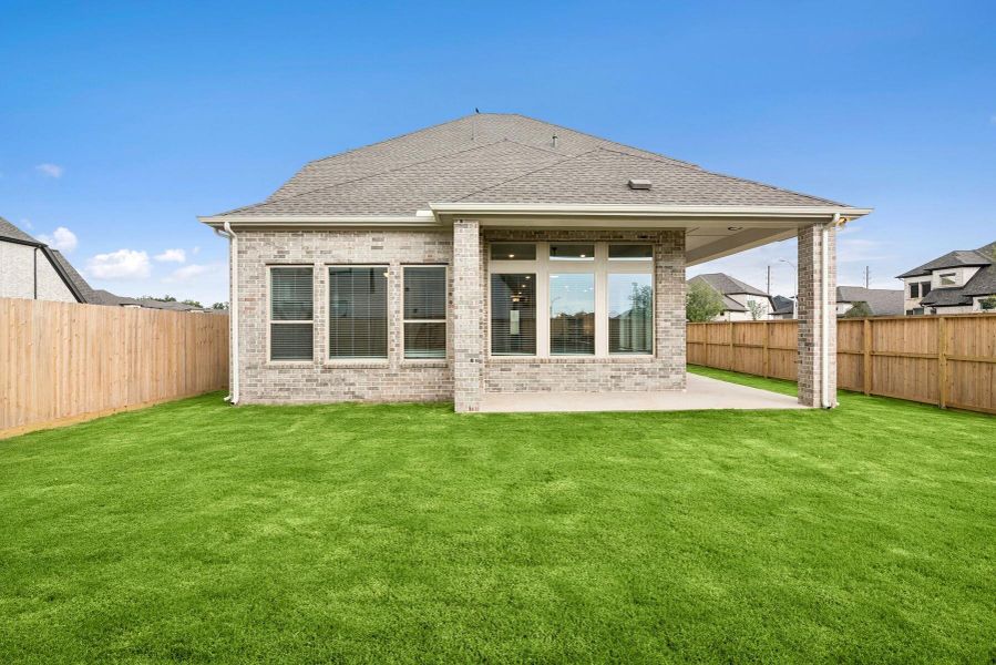Front exterior of a new home in Harvest Green 45', Richmond, TX, highlighting curb appeal (Image 27).