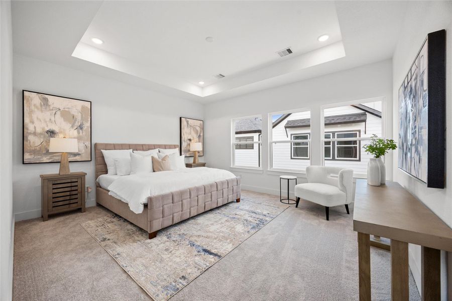 Relax and unwind after a long day in this impressive primary suite! This generously sized room offers plush carpeting, warm-toned paint, high ceilings with recessed lighting, and a wall of large windows allowing in the natural light to brighten this gorgeous room. Relax and unwind after a long day in this impressive primary suite! This generously sized room offers plush carpeting, warm-toned paint, high ceilings with recessed lighting, and a wall of large windows allowing in the natural light to brighten this gorgeous room.