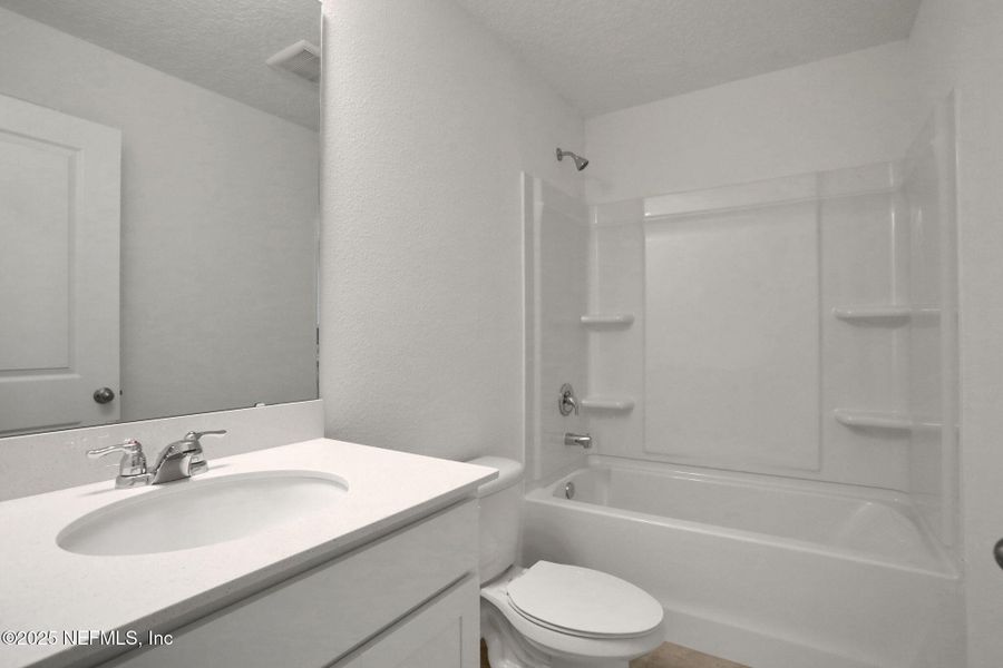 Furnished interior view inside a new home in Atlantis Pointe, Middleburg (Image 10).