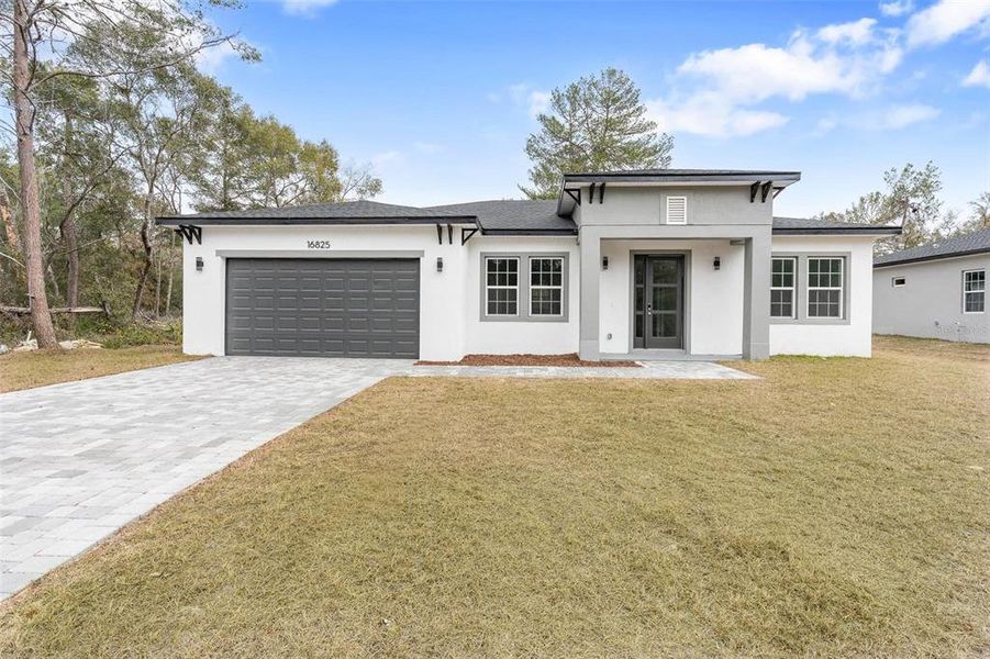 Front exterior of a new home in , Ocala, FL, highlighting curb appeal (Image 20).