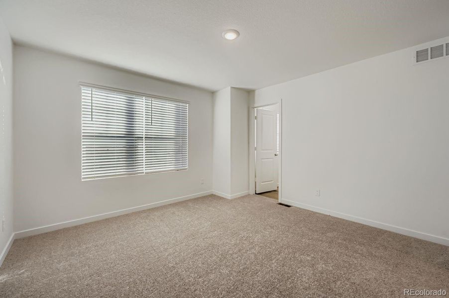 Spacious, unfurnished interior of a new home in Percheron: The Explorer Collection, Colorado Springs (Image 7).