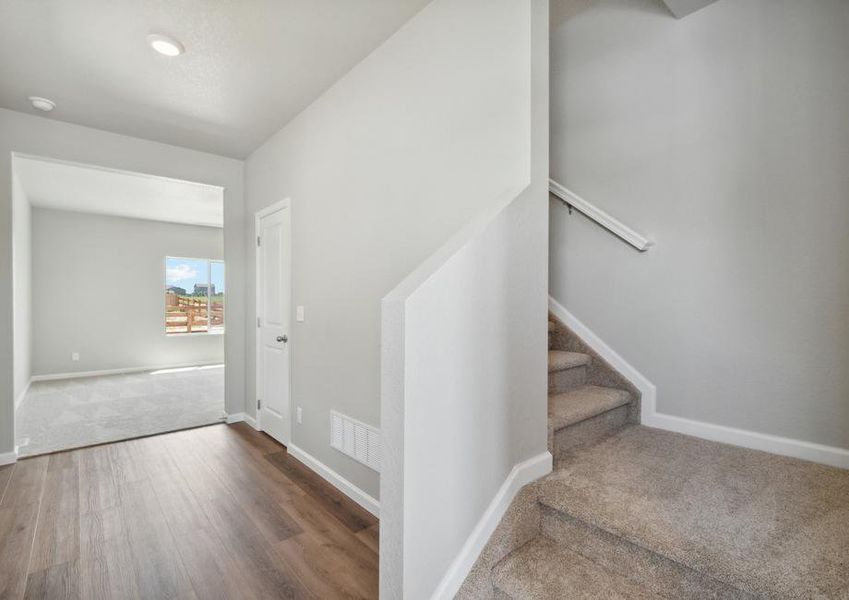 The foyer leads from the front door to the family room, kitchen and dining room.