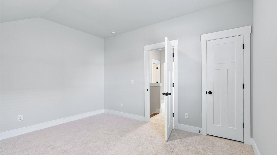 First-rate bedroom with plush carpeting and large windows that provide an open, airy feel First-rate bedroom with plush carpeting and large windows that provide an open, airy feel
