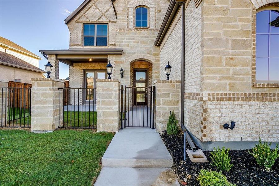 Doorway to property with a yard