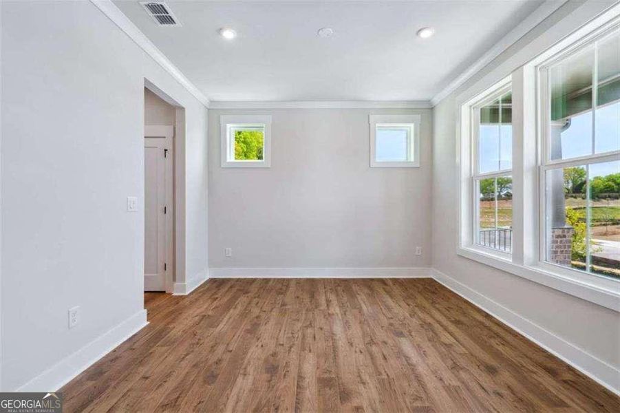 Spacious, unfurnished interior of a new home in The Paddocks at Doc Hughes, Buford (Image 24).