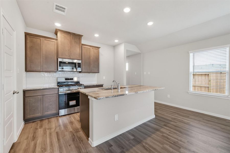 Furnished interior view inside a new home in Sunterra, Katy (Image 7).